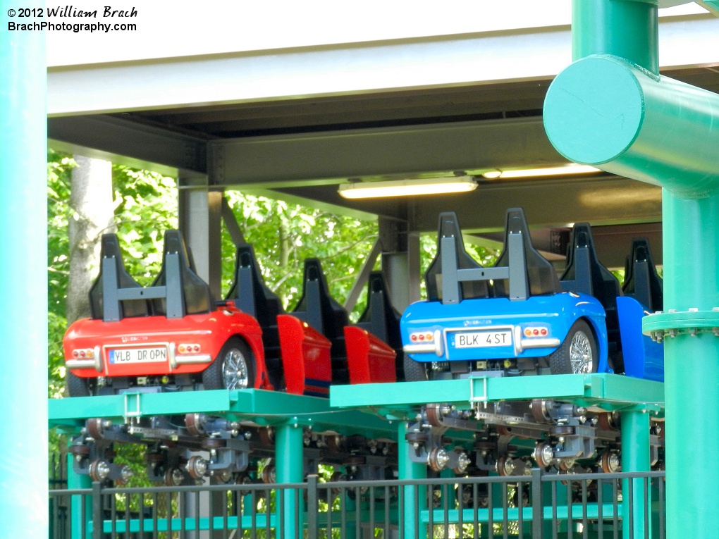 Red and blue trains in the storage bays.