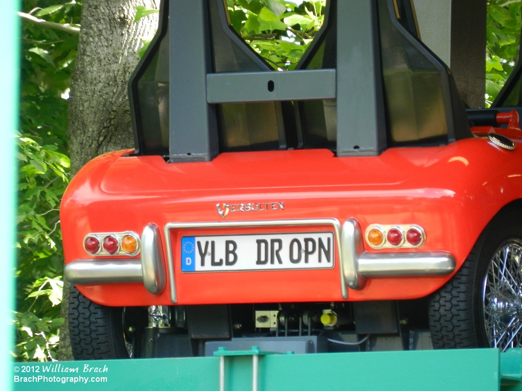 Close up detailed view of the red train's license plate.