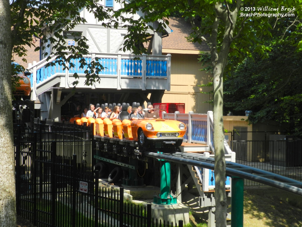 Here we see the Orange train ov Verbolten awaiting dispatch while the next two trains are unloading/loading inside the station behind it.