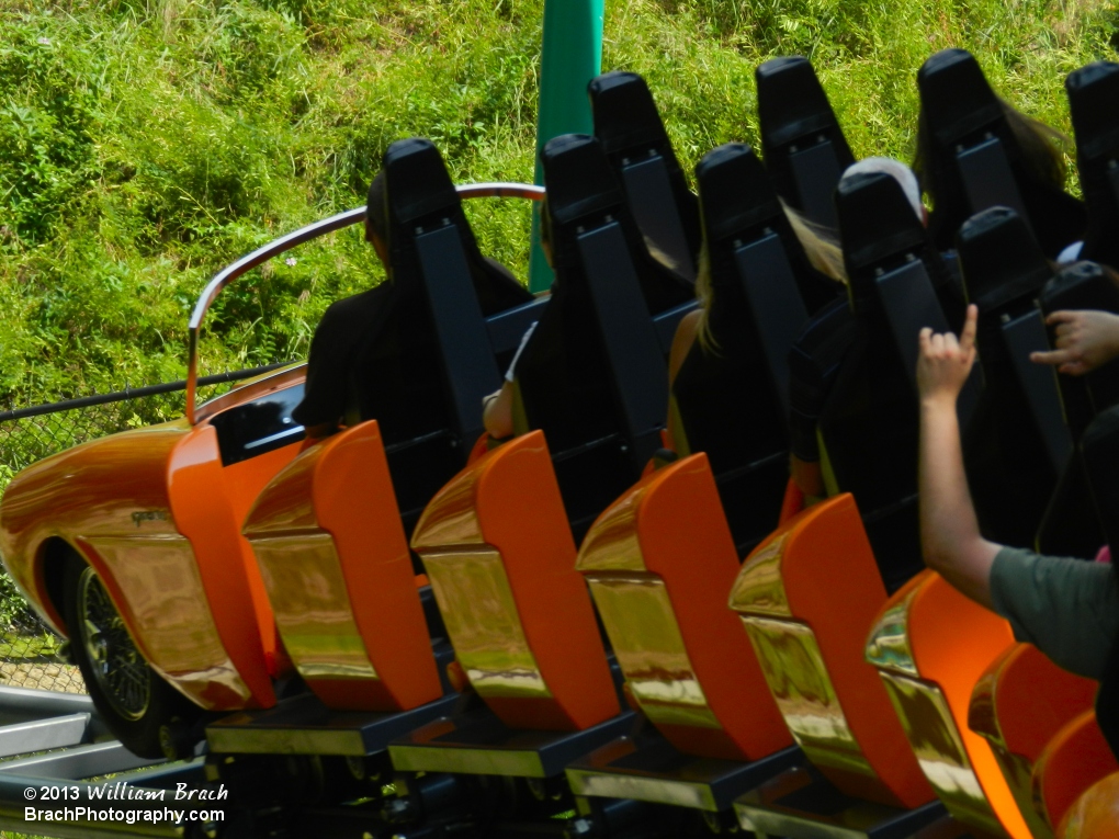 Orange train venturing out on the course.