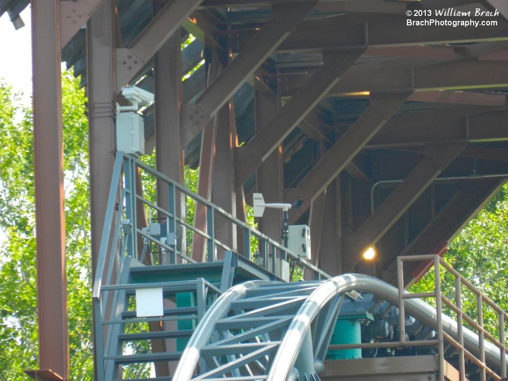 Looking inside the broken bridge, I see a security camera, and a weather vane?!