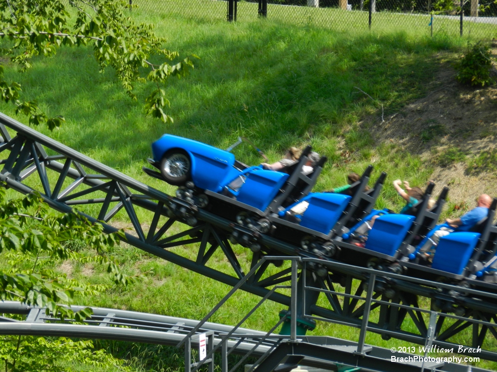 Blue train rushing out of the Black Forest.