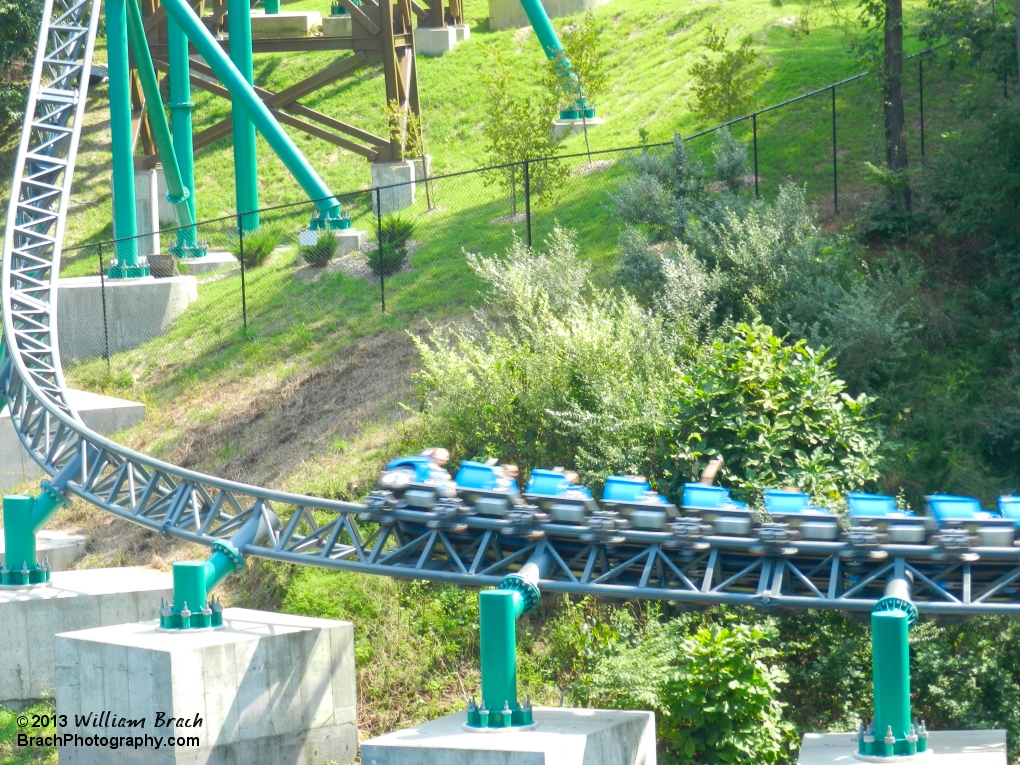 Verbolten's blue train rushing over the Rhine River - Another nod to the former Big Bad Wolf coaster that was previously in this spot.