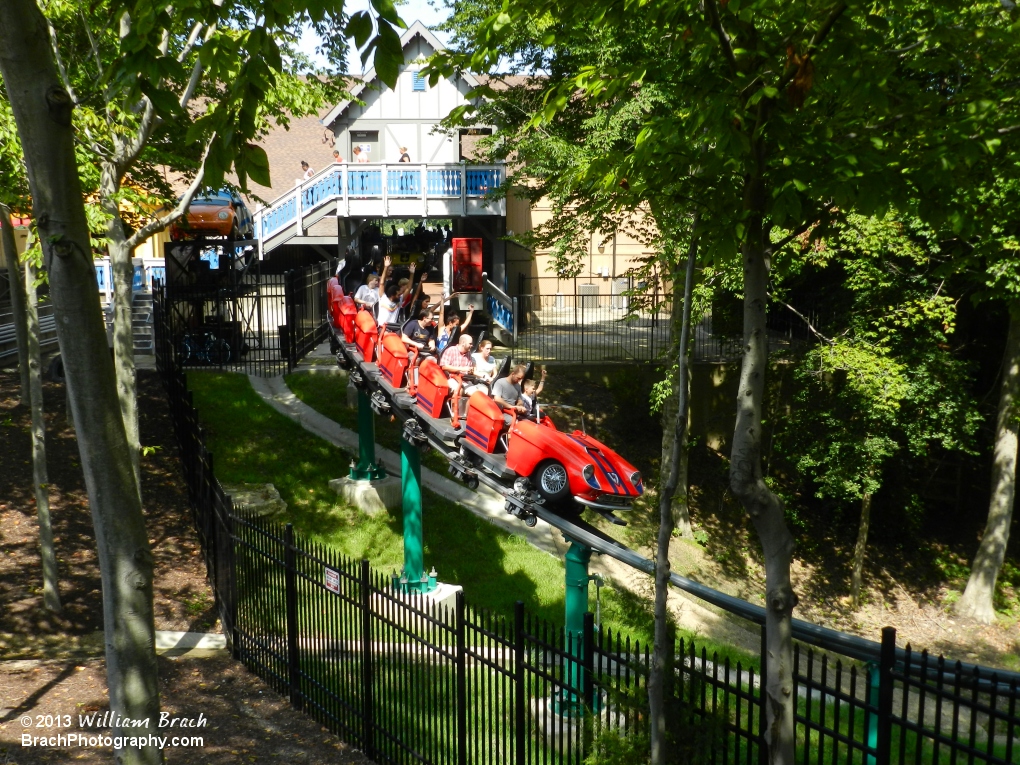 Red train departing the station and headed out on it's next adventure.