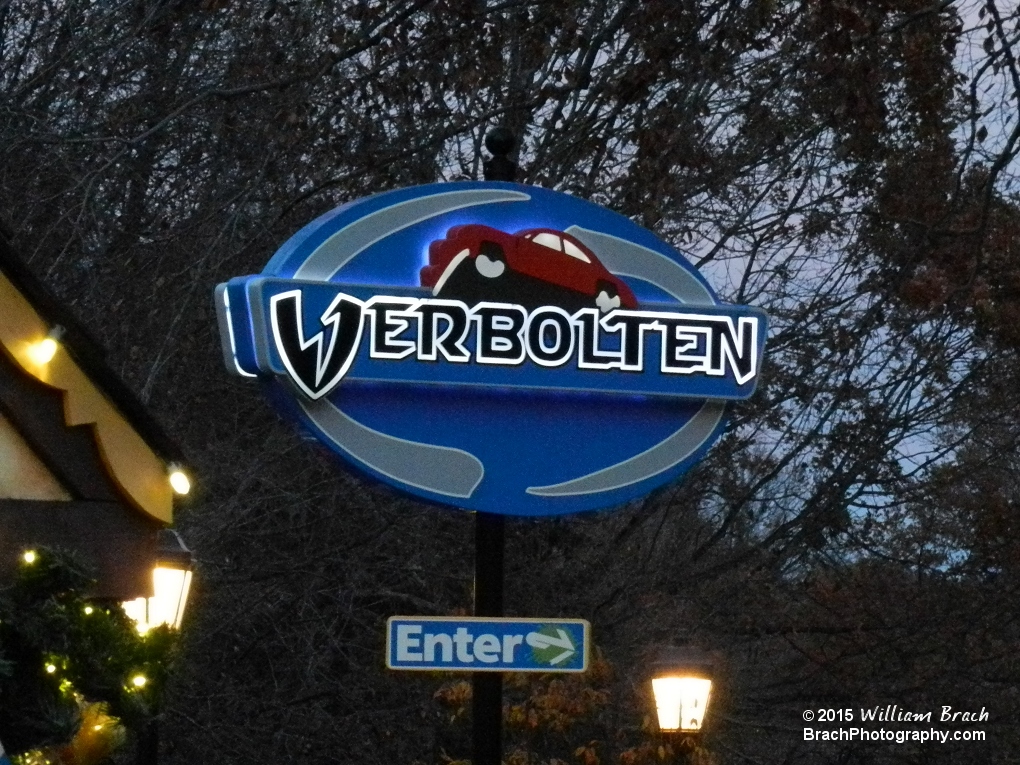 Verbolten's sign all lit up at night.