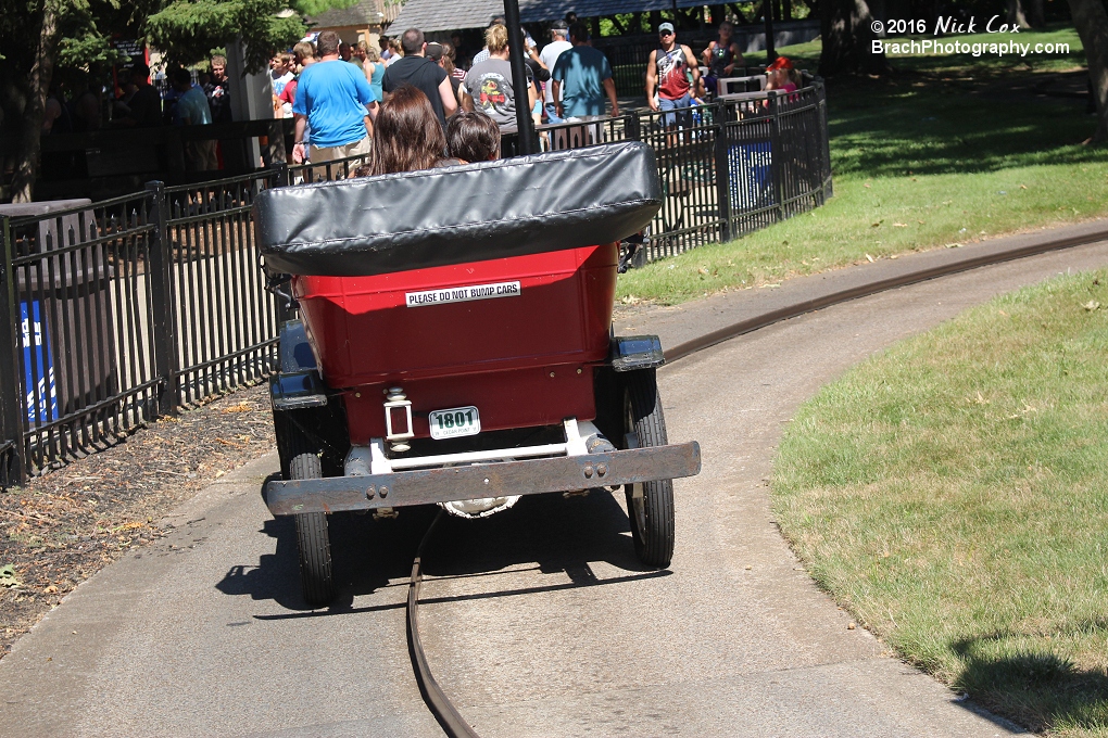 A group of riders going down the track.