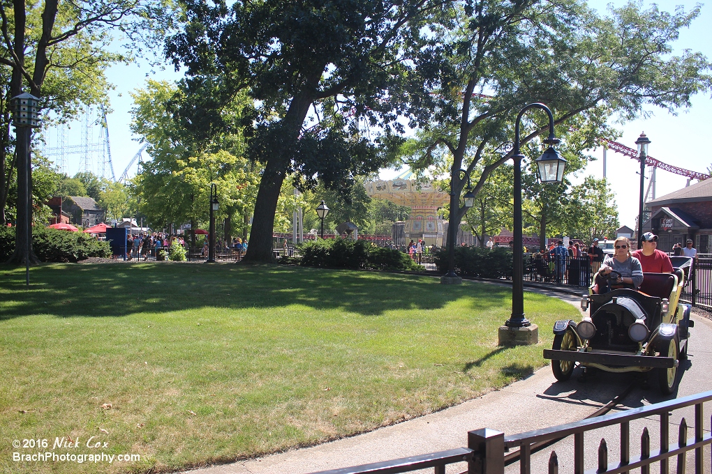 A wide angle of the area and the car.