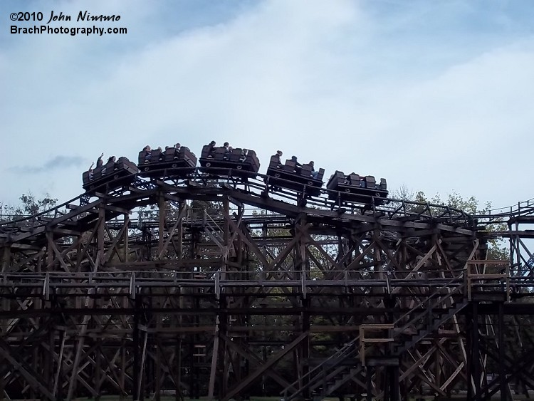 Although this ccoaster has wooden supports, it is classified as a steel coaster.  The reason behind this is because the track the cars ride on is steel, not wood; thus classifies Cedar Creek Mine Ride as a steel coaster.