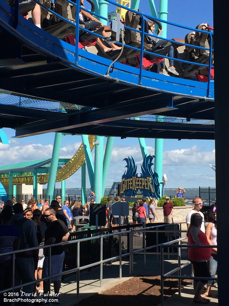 GateKeeper train leaving the station with Wicked Twister and the GateKeeper sign in the background.