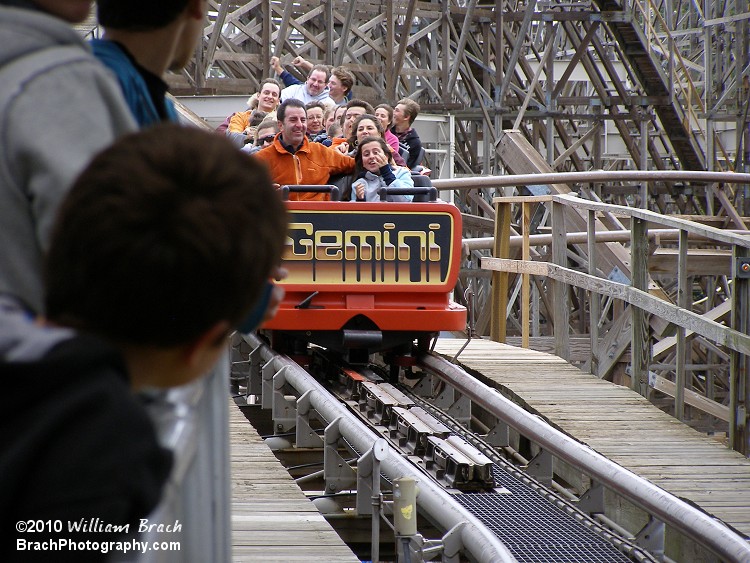 Red train is exiting the helix and entering the brake run.