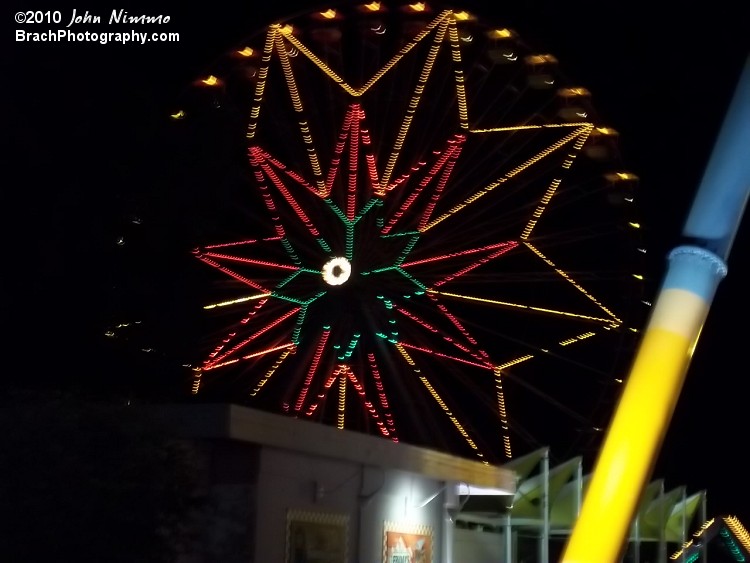 Beautifully lit big wheel at night.  Even the cabins themself are lit up.