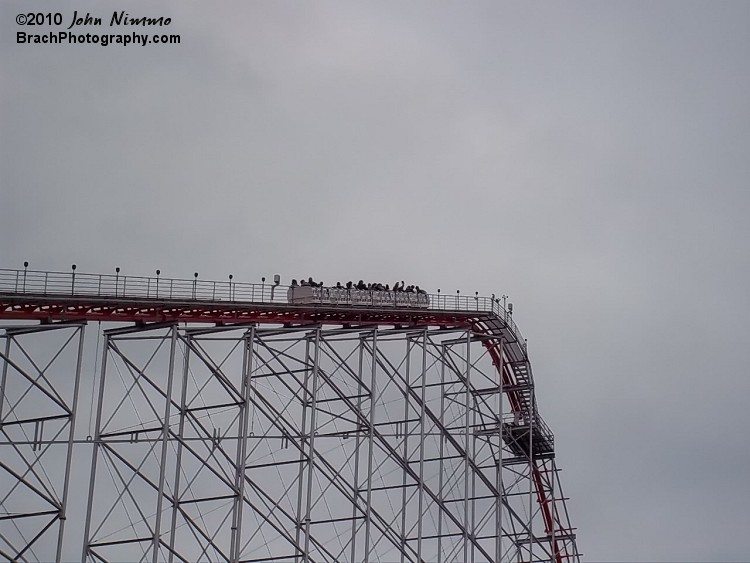 One of its three trains is makig the climb up the lift hill.