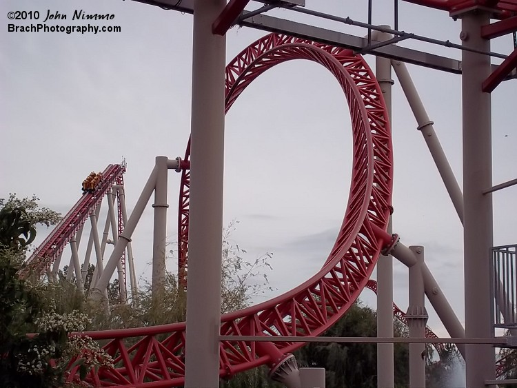 Lift to the left, loop in the center, brake run at the top.