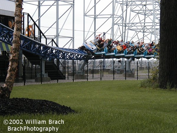 Blue train going up the lift hill.