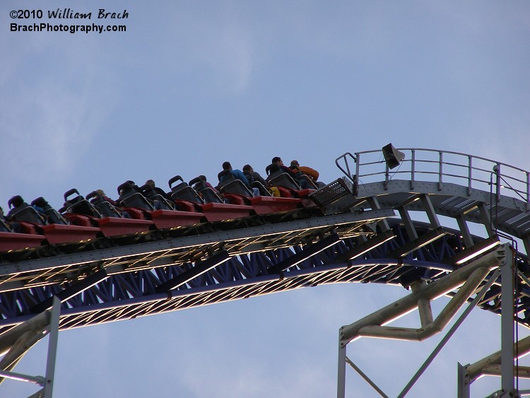 The red train is being pulled up to the top of the lift hill before it goes on its adventure featuring an 80 degree drop of 300ft.