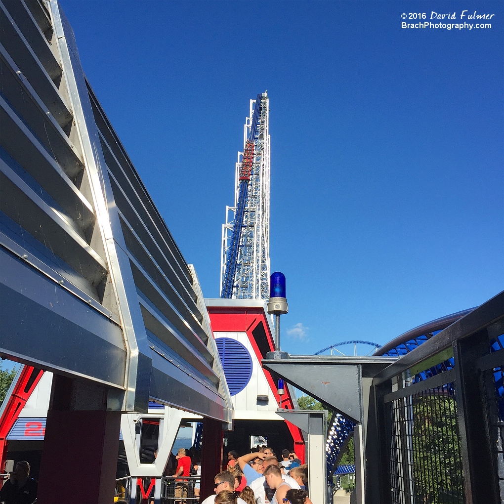 Watching the red train go up the lift hill of Millennium Force from the queue line.