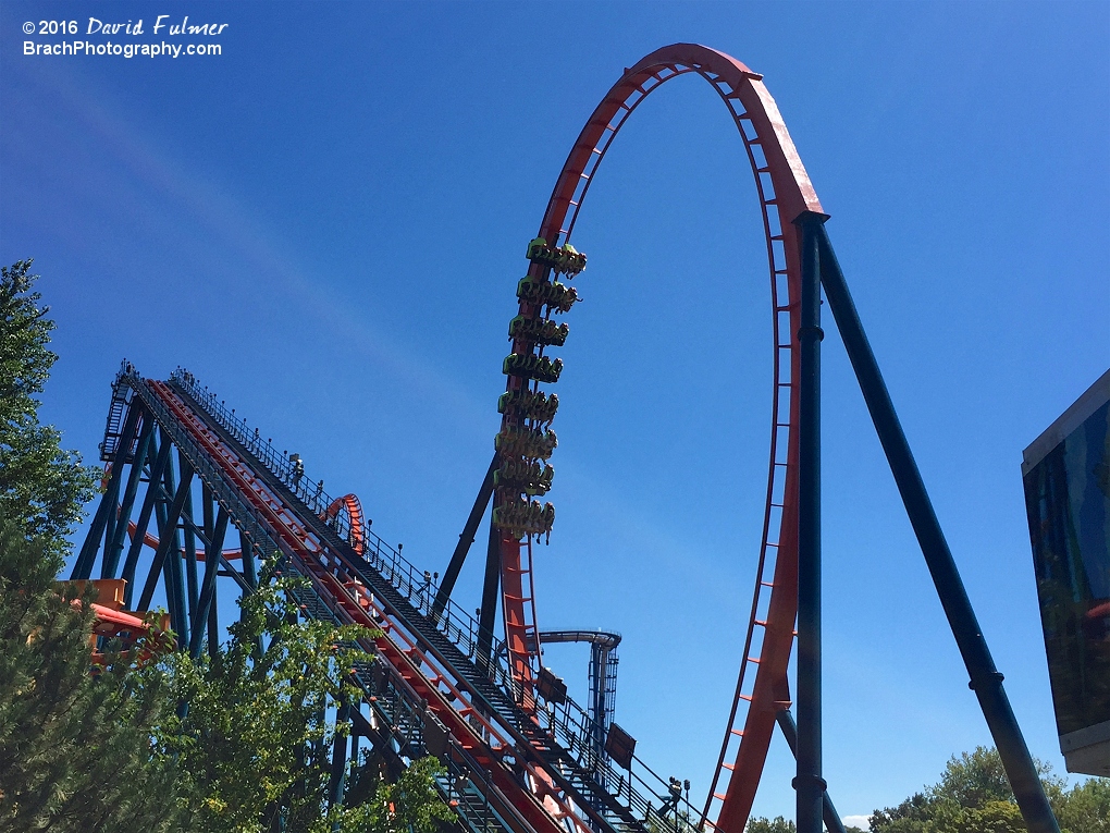 Rougarou train going through the vertical loop.  Rougarou is now a sit-down floorless coaster.