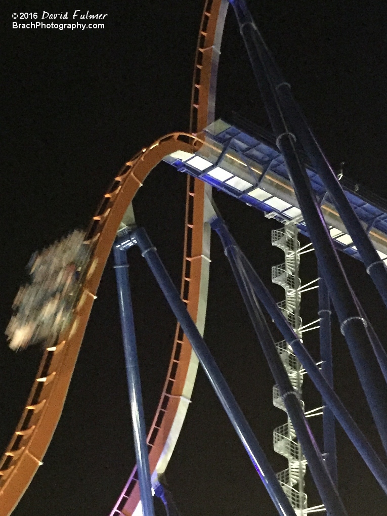 Looking at a Valravn train dropping out of the mid-course brake run at night.