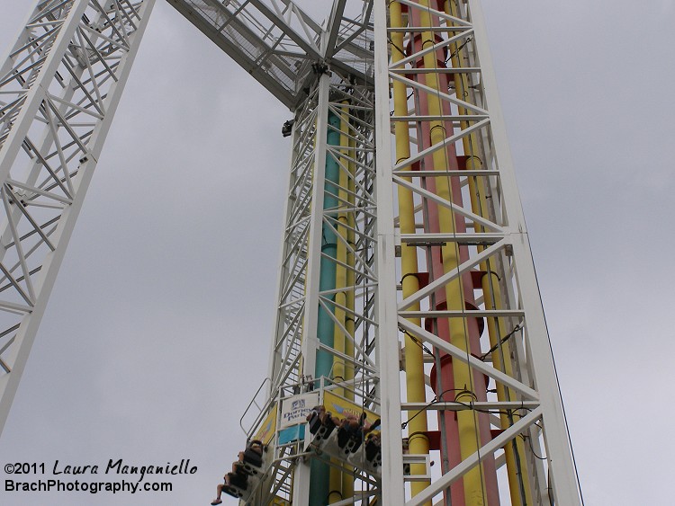 Dominator has two sides.  The green side is the drop towere, where you get pulled up to the top, then dropped down.  The red side is the space shot side where you get shot straight up and gravity does the rest.