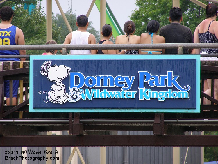 Park logo and sign seen on the observation bridge of White Water Landing.