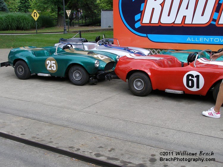 This ain't your grandpappy's Tin Lizzie ride, these are pure Muscle Cars!  They pack quite a punch - you get to tear across the track at a blazing FIVE mph!