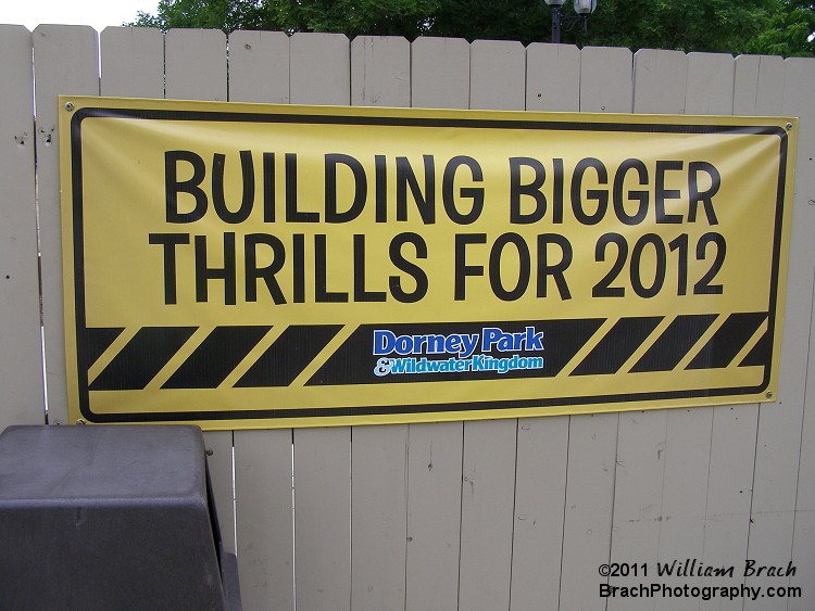 The area beyond Possessed was boarded up with this fence and the park hung signs like this one indicating that there would be something new for 2012 in this area.  The park would later announce that they woiuld be installing a relocated Vekoma Invertigo from Great America.  The ride would be named Stinger using a scorpion theme and logo design.