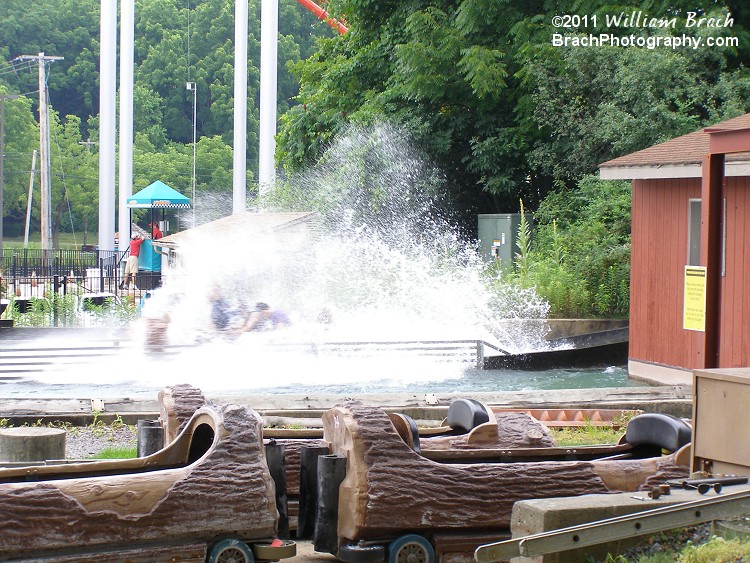 Another log filled with happy riders getting slightly wet from the water.