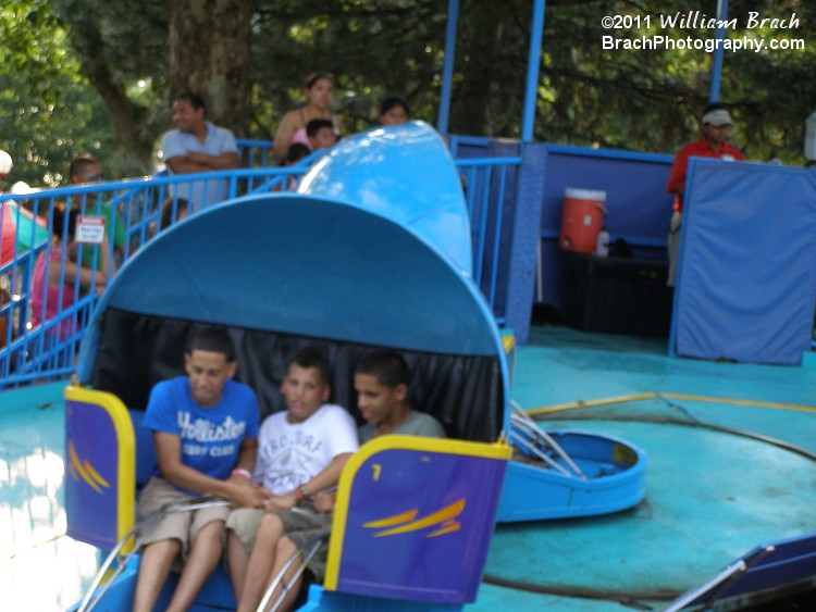 Tilt-a-Whirl running and spinning its riders.