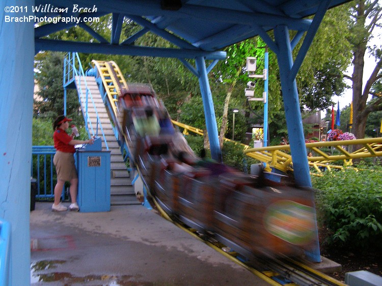 Zooming through the station, the coaster goes around the circuit twice!