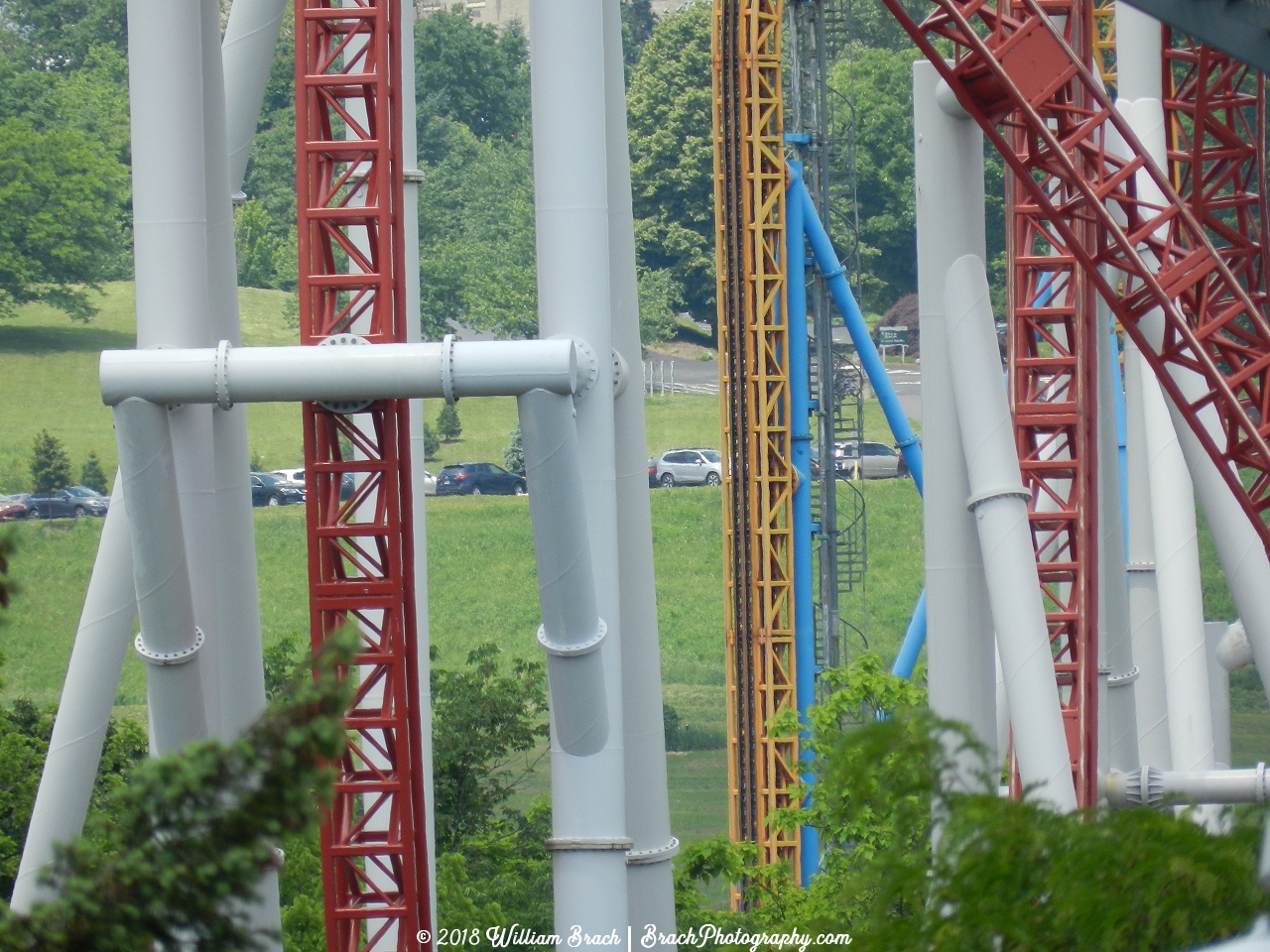 Through the structure of Storm Runner, you can see the vertical lift hill of Fahrenheit.