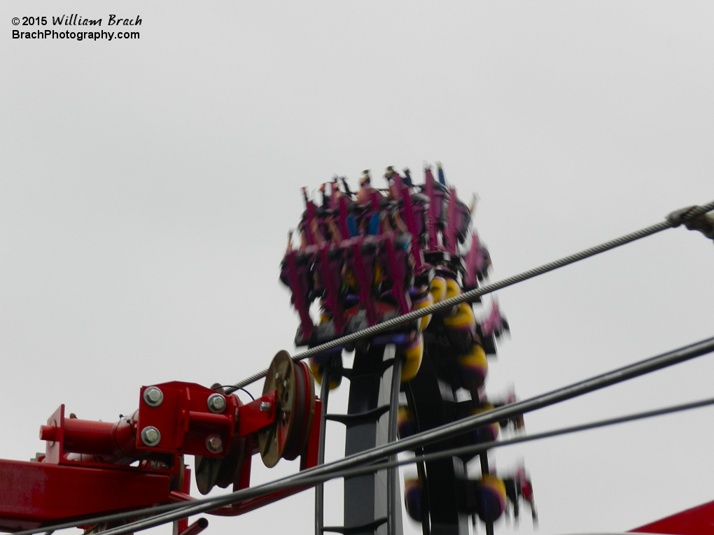 Another train on Great Bear going through the vertical loop as seen from the Sky View ride.