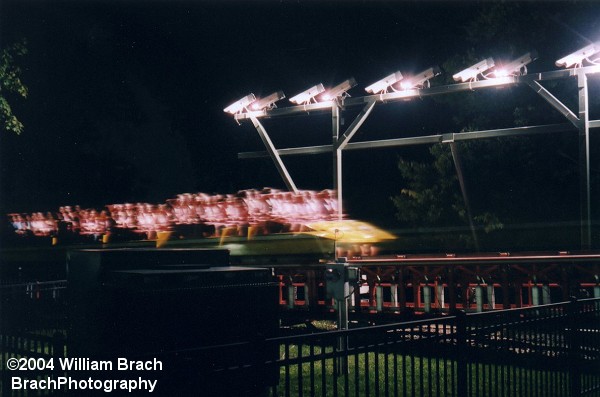 If you look closely, you will make out double faces for every rider.  Strobe lights flashed twice to get a good photo of the riders expressions as they were being launched.