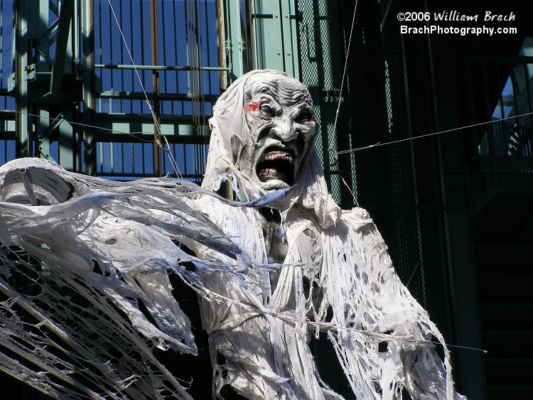 Seen hanging from the Eiffel Tower to scare people.  Blacklight floods were shining on her to illuminate the white fabric and give it a very creepy look.