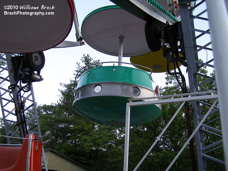 An empty green gondola and the ride's drive mechanism are seen here.