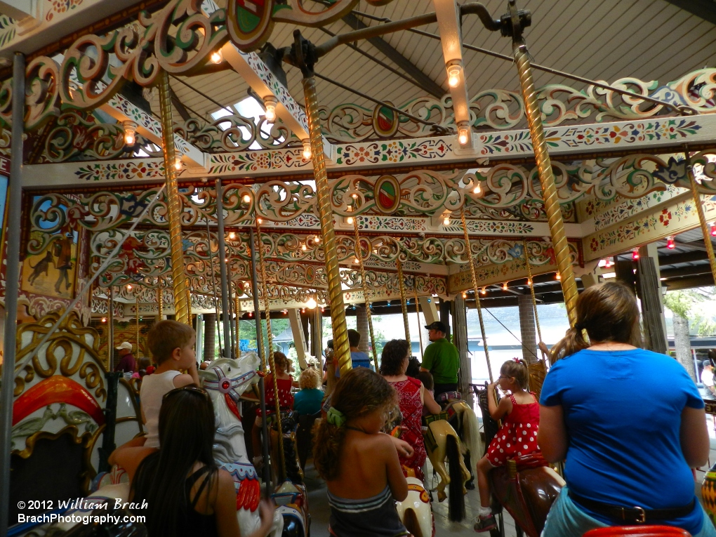 Taking a ride on the Grand Carousel.