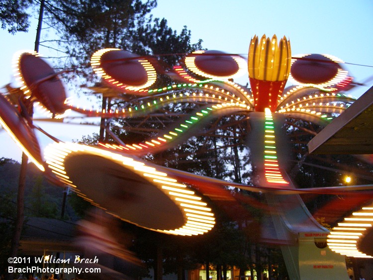 The ride all lit up at dusk.