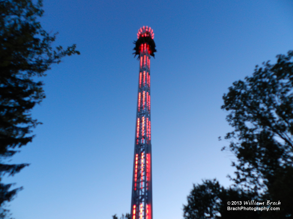 StratosFear lit up in red lights at night,