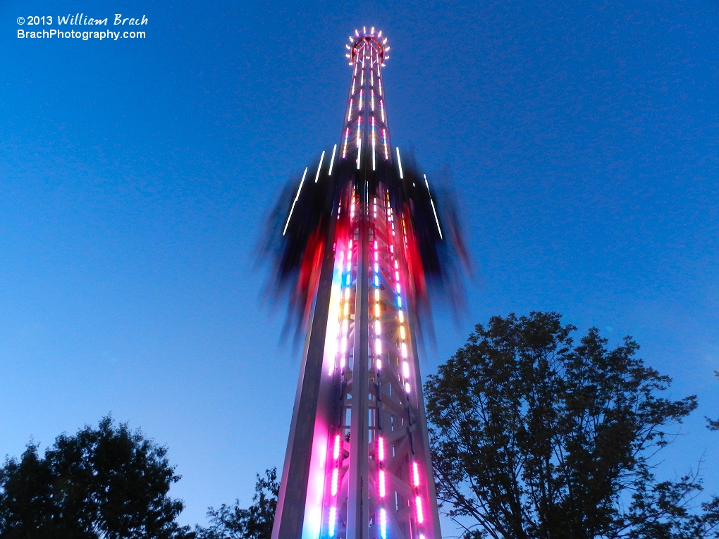 Riders dropping back to Earth on StratosFear at dusk.