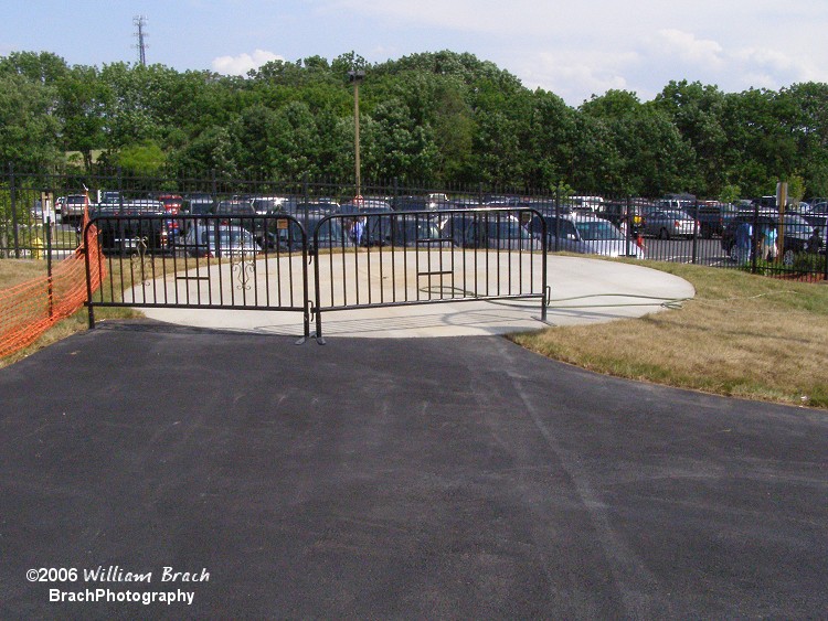 Vacant circle of concrete awaits a ride to be installed on it.