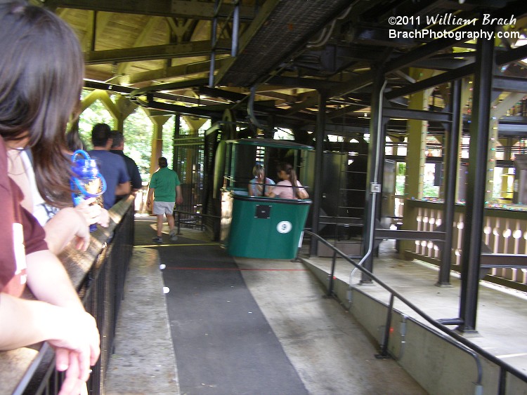 Inside the Station in the German section of Busch Gardens.  Green cabin departing the station.