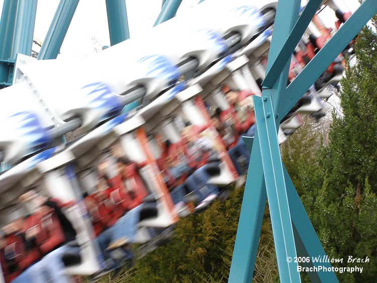 Alpengeist train rushing by on the first drop.