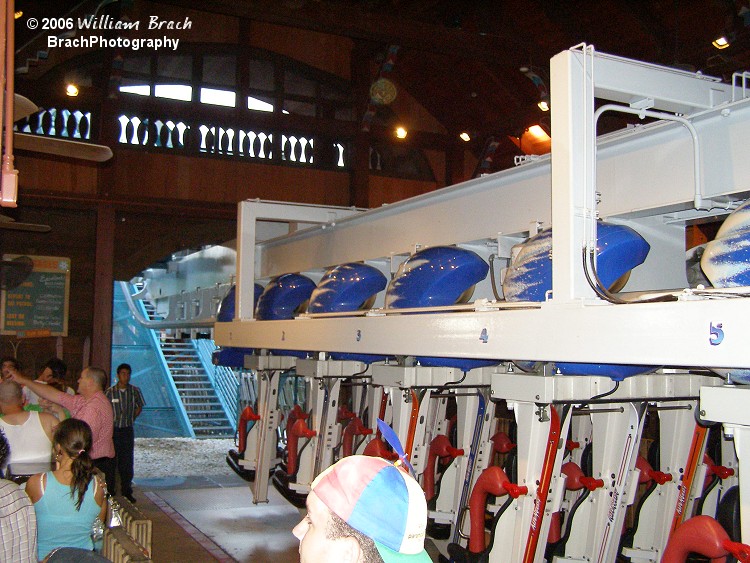 That guy in the beanie is Clint of the Coaster Crew.  One of the most commonly heard chants inside the station is "DROP THE FLOOR!" Asking the Ride Ops to dispatch the train already.  The floor does indeed drop out from under your feet in the station to allow the train to depart and arrive safely.