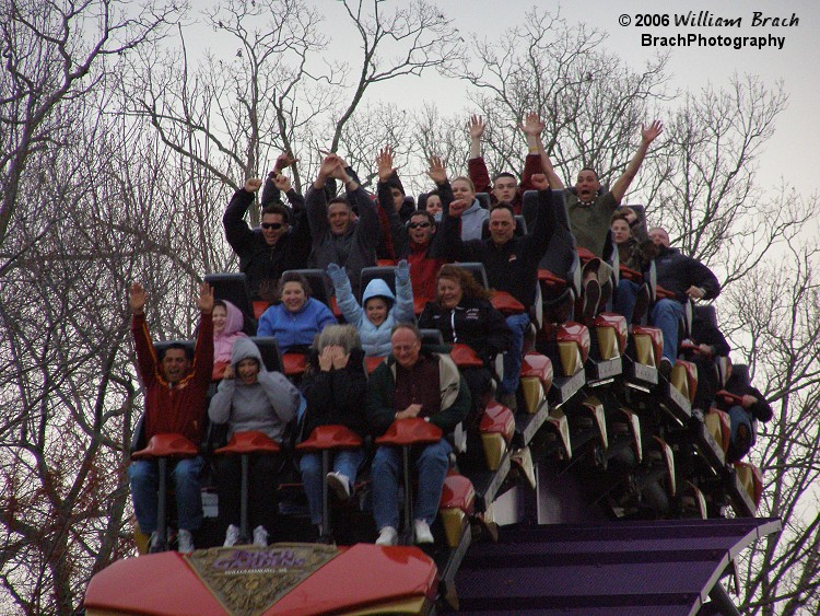 The train approaching the on-board souvineer photo station.  I love how the two in the front row are doing the Hear-No-Evil, See-No-Evil bit (either that or it's because it was only 50 degrees out on Opening Day 2006).