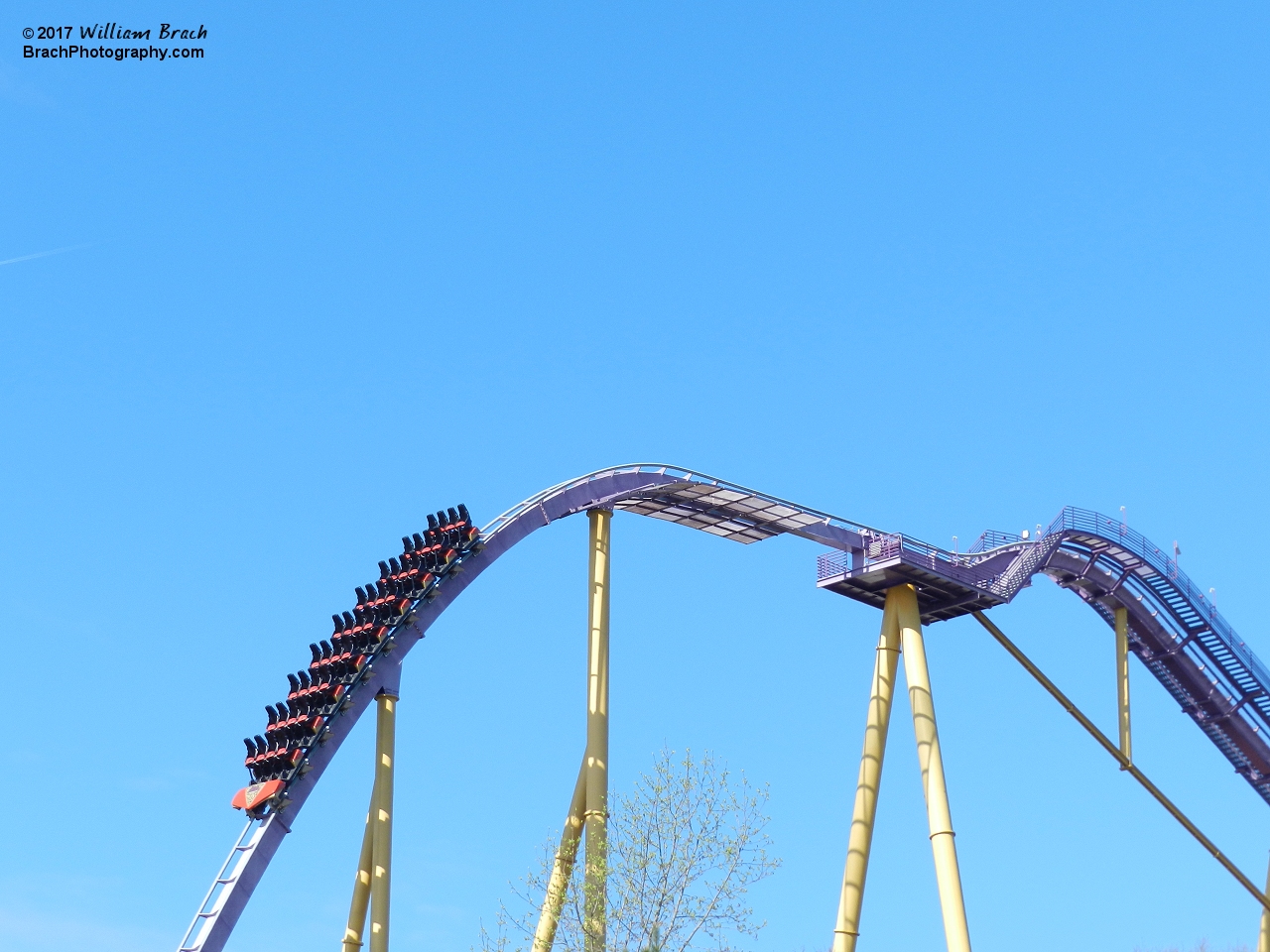 Another empy train taking a test run before the park opens for the day.