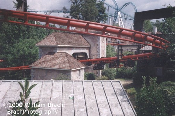 Big Bad Wolf train running through the Village.  That's the then Standing But Not Operating (SBNO)  Drachen Fire in the background.