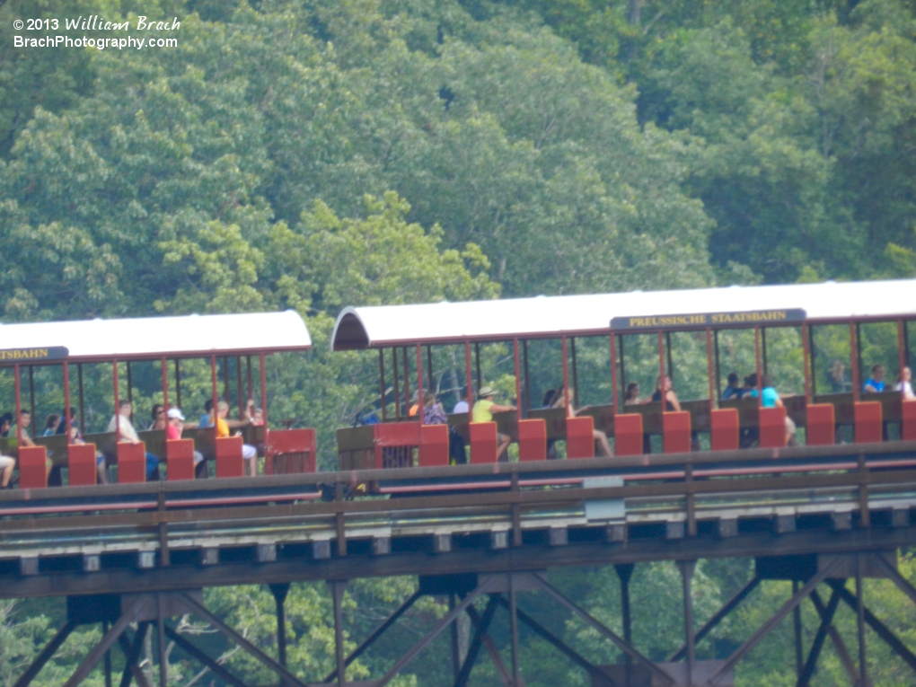 The German Red train crossing the bridge connecting Italy and Germany sections of the park.