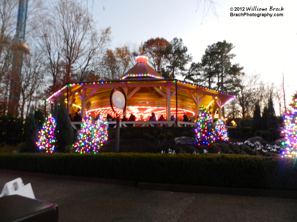 The park's carousel ride lit in festive lights.