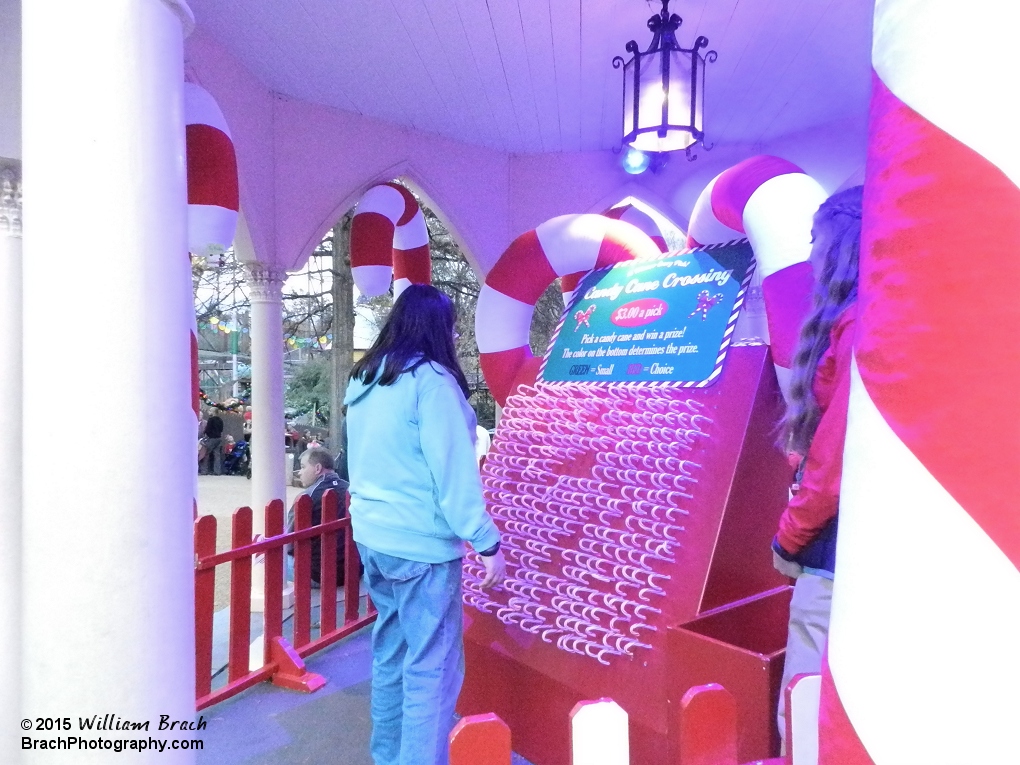 Laura trying her luck at the Candy Cane Game.  She won a small plush candy cane.