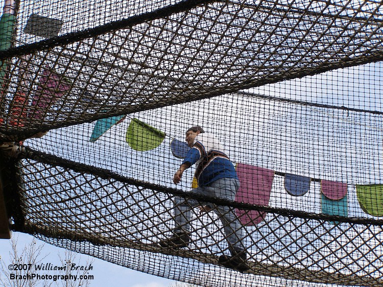 Clint Novak climbing around in the rope climb area in the Land of the Dragons on Opening Day 2007.