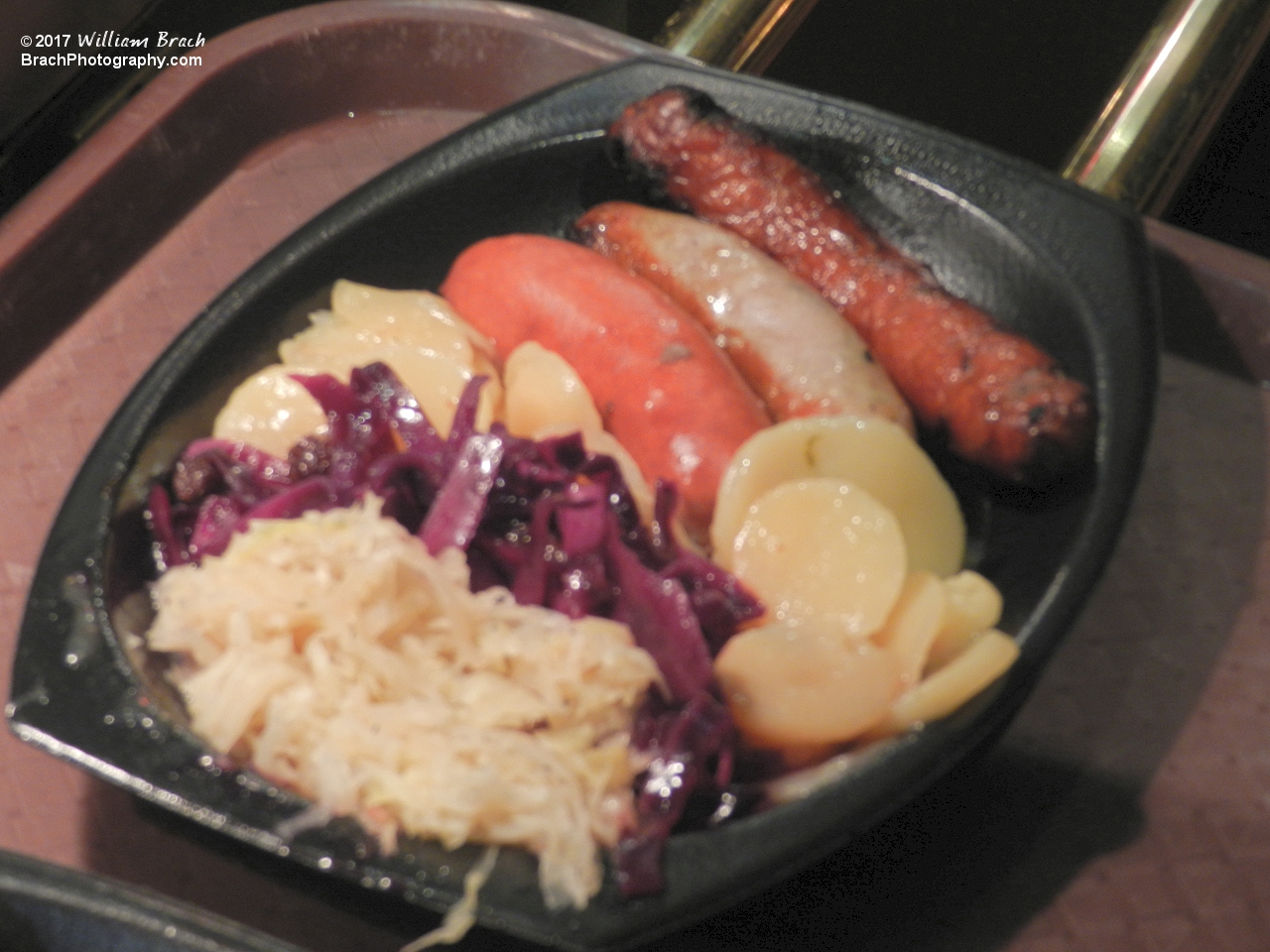 German Sausage Sampler Platter - Knockwhurst, Bratwhurst, Smoked Sausage, Sauerkraut, Red Cabbage and German Potatoes.